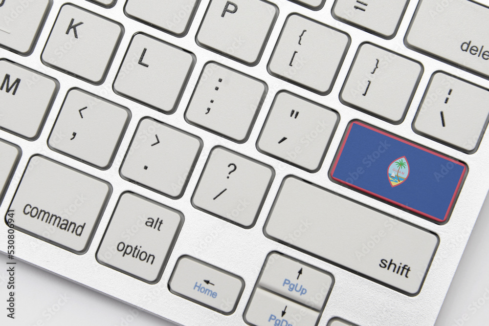 national flag of guam on the keyboard on a grey background .3d illustration national flag of guam on the keyboard on a grey background .3d illustration
