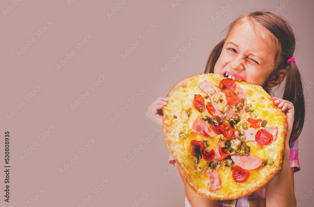 Photo of attractive young beautiful girl eats big slice of pizza. Copy space. Photo of attractive young beautiful girl eats big slice of pizza. Copy space.