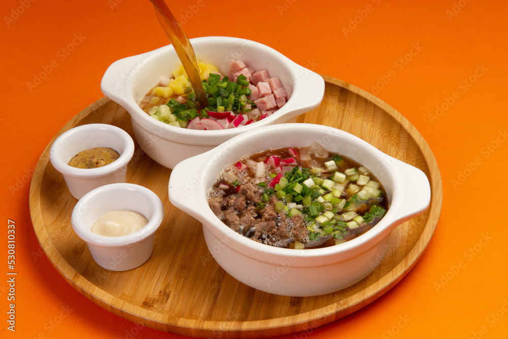 Traditional cold okroshka soup. With meat and sausage. Traditional cold okroshka soup. With meat and sausage.