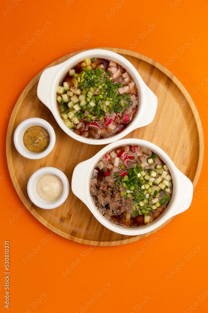 Traditional cold okroshka soup. With meat and sausage. Traditional cold okroshka soup. With meat and sausage.