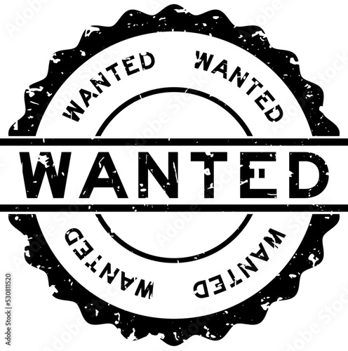 Grunge black wanted word round rubber seal stamp on white background