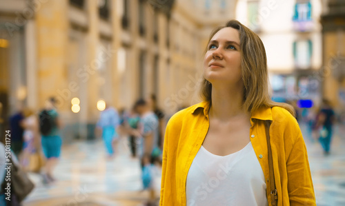 Woman tourist exploring Galleria Umberto in Naples.