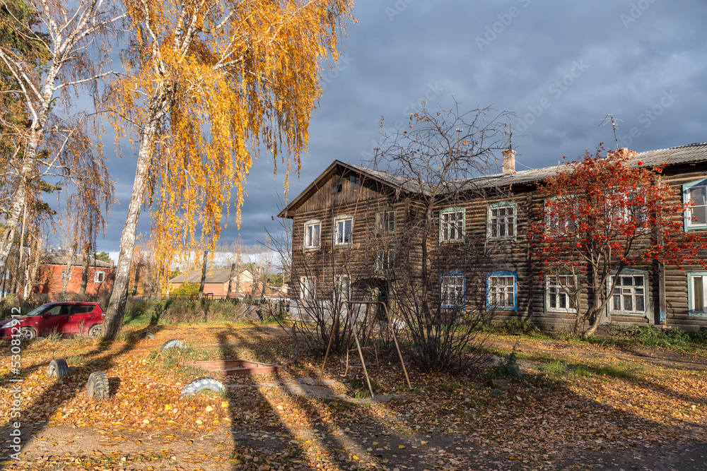 Autumn in a provincial Ural town (Russia) looked into the courtyard Autumn in a provincial Ural town (Russia) looked into the courtyard