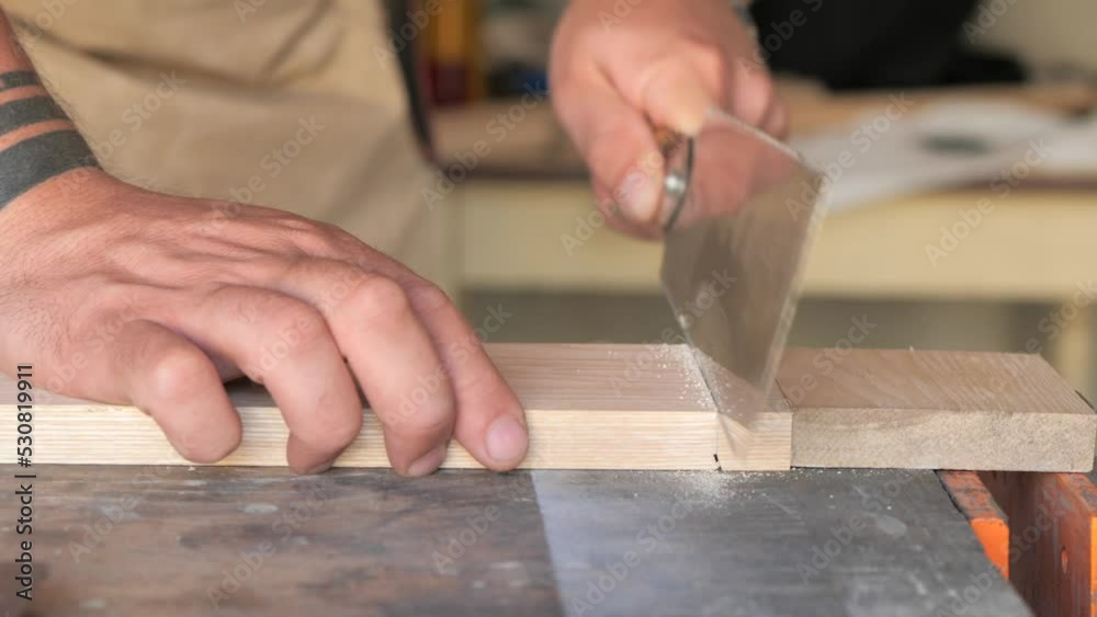 woodworker with Japanese saw woodworker with Japanese saw