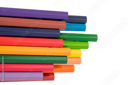 Several colored pencils, close-up, isolated on a white background.