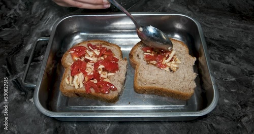 baked tomato sauced bread on a plate