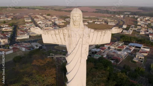 Sertaozinho, São Paulo / Brazil - Circa june 2022: Aerial image of the city of Sertaozinho, SP. Christ the Redeemer monument of the city, way of faith photo