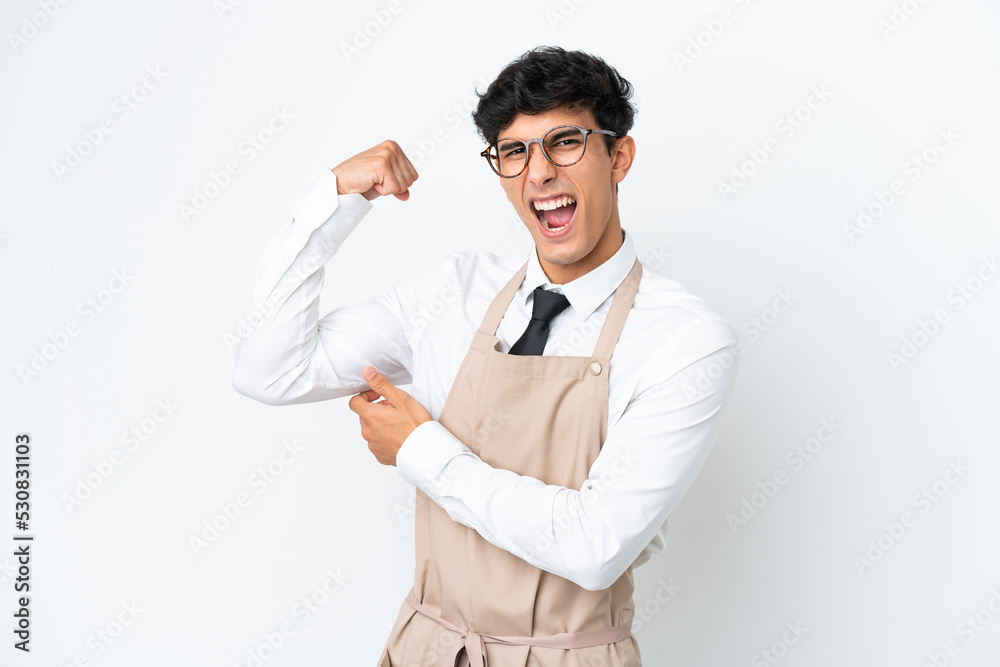 Restaurant Argentinian waiter isolated on white background doing strong gesture Restaurant Argentinian waiter isolated on white background doing strong gesture