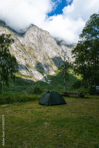 Wild camping  tent on nature Norway mountains with tree in green garden or forest for holiday relax and vacation travel trip to trekking picnic on meadow grass