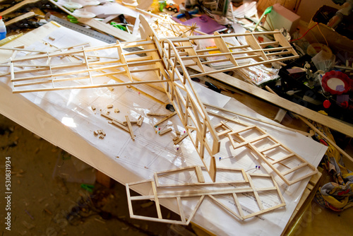 Making model airplane from balsa wood. handcrafted on work table
