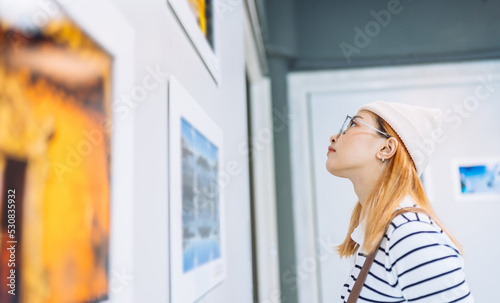 Woman visiting art gallery her looking pictures on wall watching photo frame painting at artwork museum people lifestyle concept. Free Download Woman visiting art gallery her looking pictures on wall watching photo frame painting at artwork museum people lifestyle concept. - GFXLoad