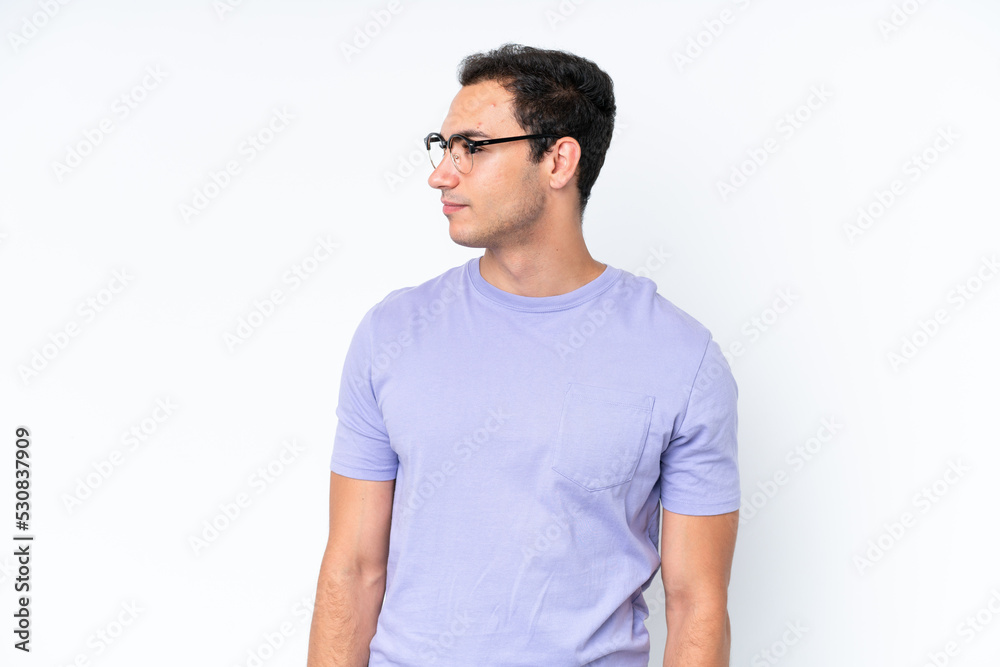 Young caucasian man isolated on white background looking to the side Young caucasian man isolated on white background looking to the side