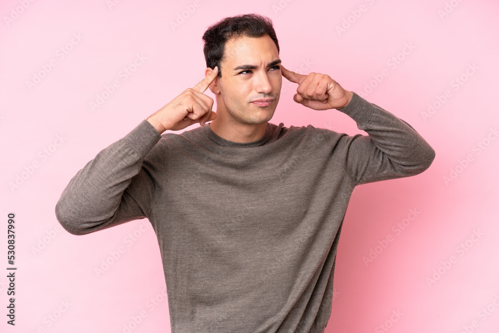 Young caucasian man isolated on pink background having doubts and thinking Young caucasian man isolated on pink background having doubts and thinking
