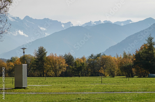 herbstlich am Reschen See mit Ortlergruppe im Hintergrund photo