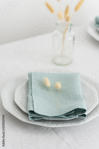 Table linens decoration with green linen napkins