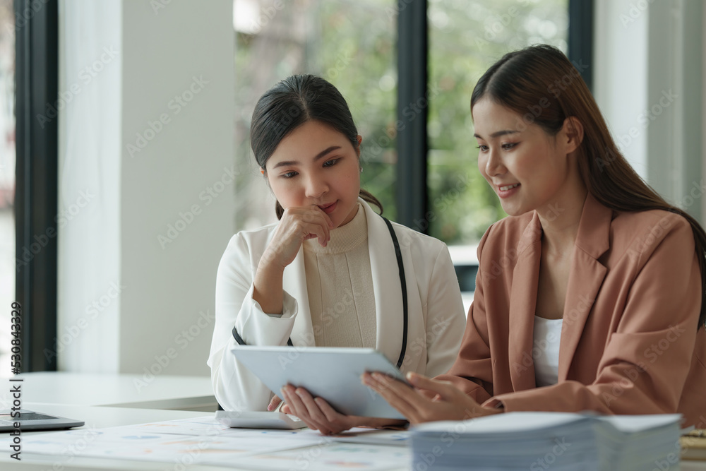 Fund managers team consultation and discuss about analysis Investment stock market by digital tablet Fund managers team consultation and discuss about analysis Investment stock market by digital tablet