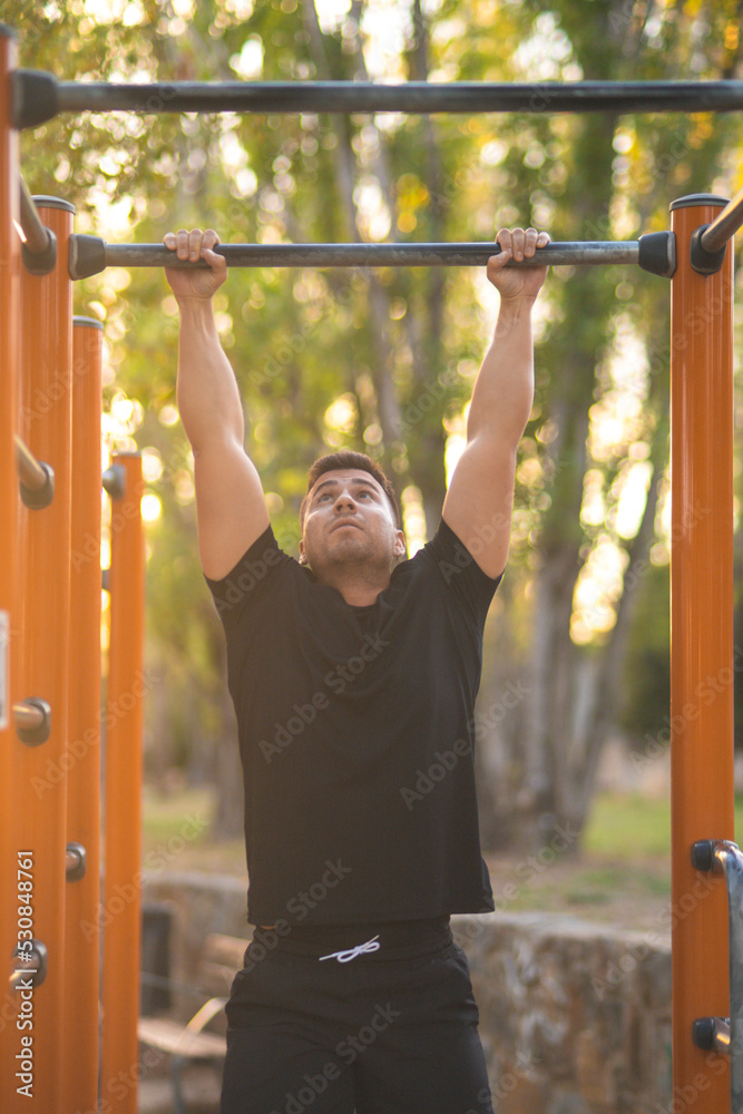 Fototapeta premium young man exercising in a park