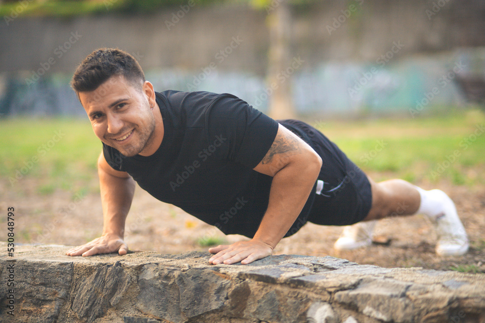 young man exercising in a park