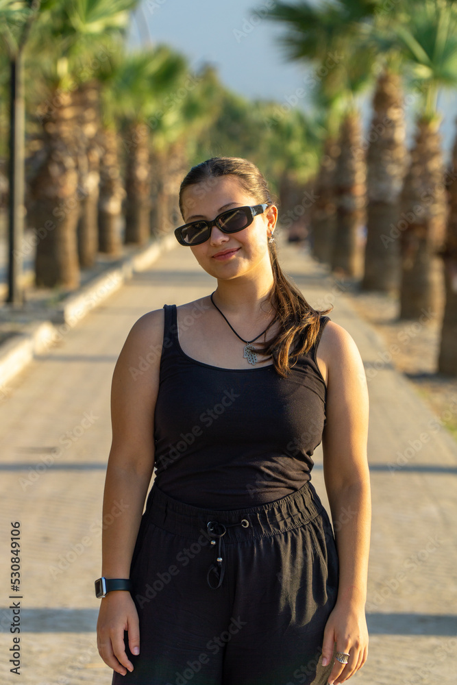 Portrait of a young beautiful girl on a sunny day