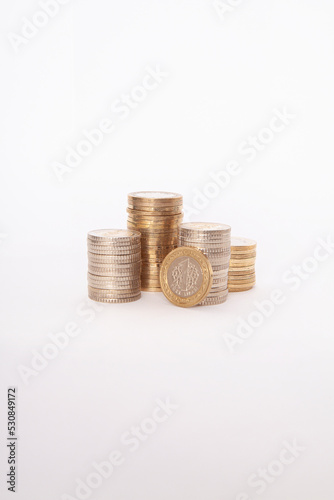  Close-up of coins stack on white background. 