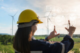 Close up engineering woman hand is touching virtual reality Analytics engineering data in a field over electrical turbines background