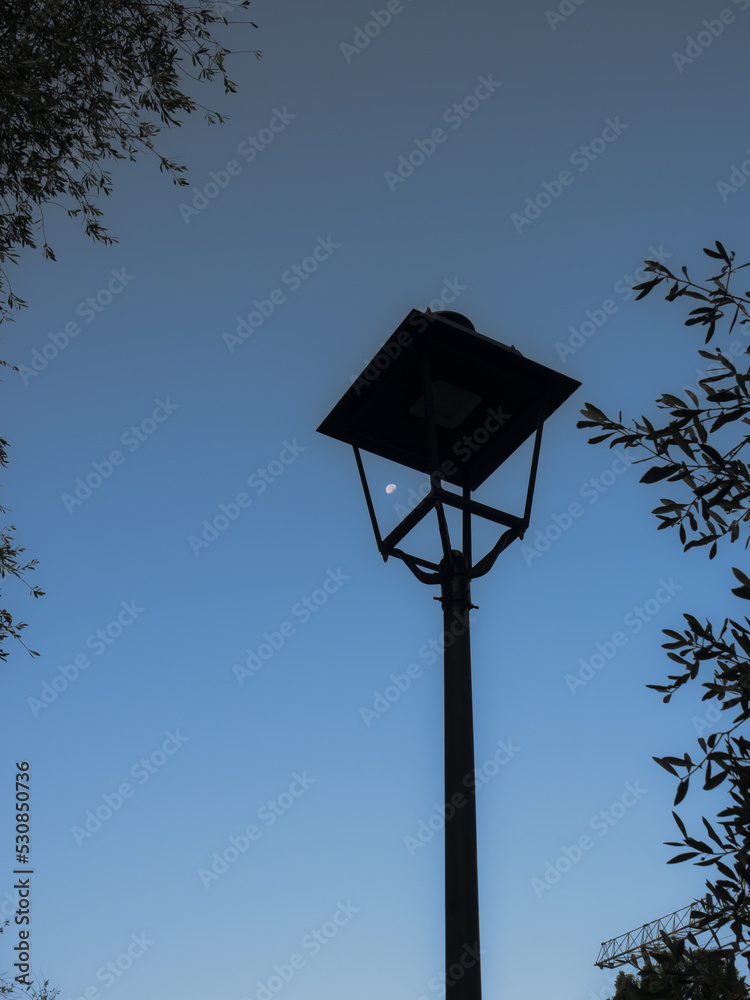 street lamp in the sky with the moon