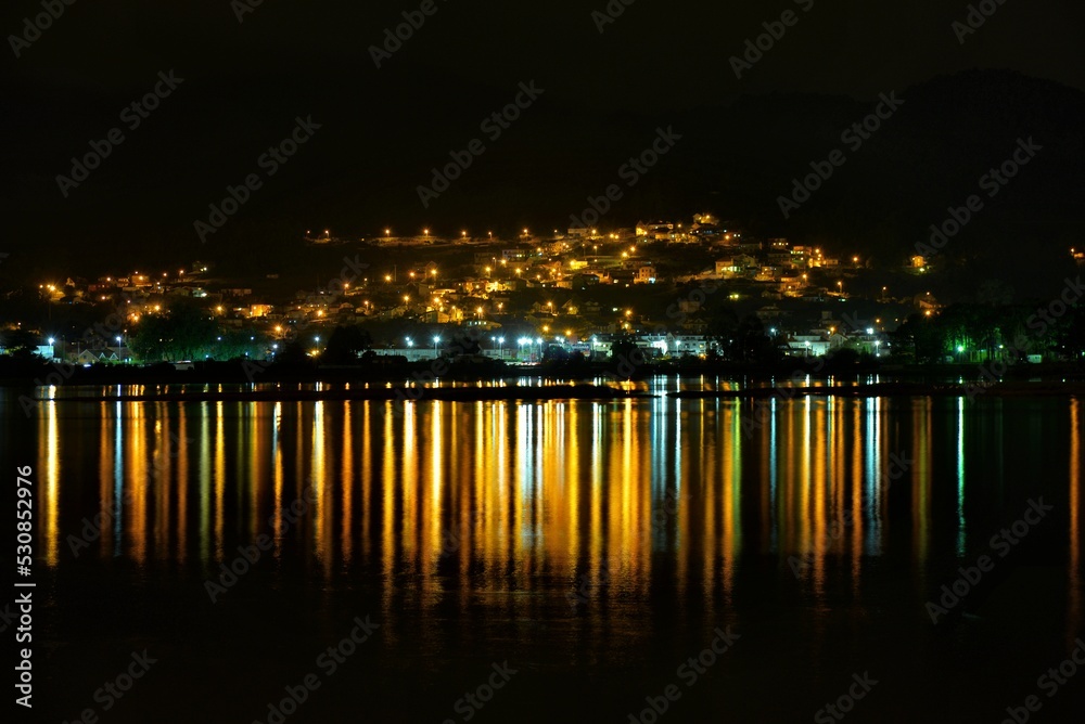night view of the city with light reflections