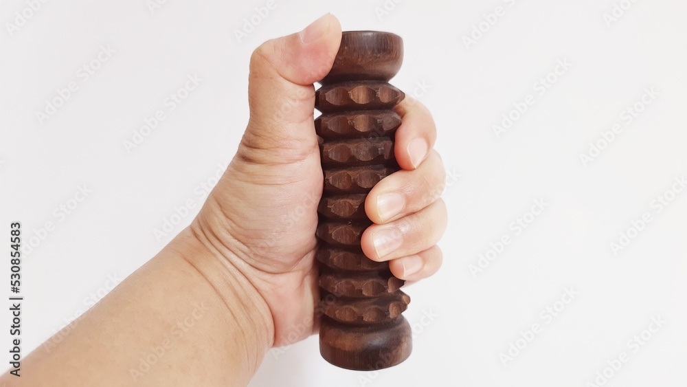 Wooden hand grip massage tool isolated on white background Wooden hand grip massage tool isolated on white background