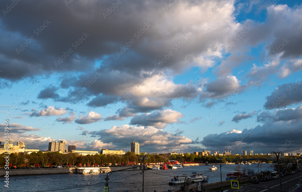 May 9, 2022, Moscow, Russia. Clouds in the blue sky over the river and Gorky Park in the Russian capital.