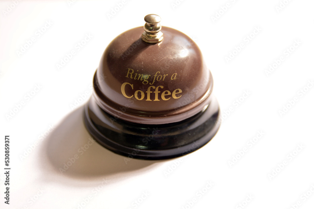 A brown bell that says A brown bell that says