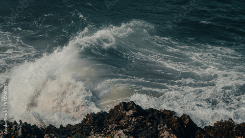 waves crashing on rocks