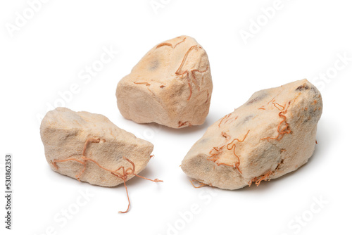 Pieces of Baobab fruit pulp close up on white background