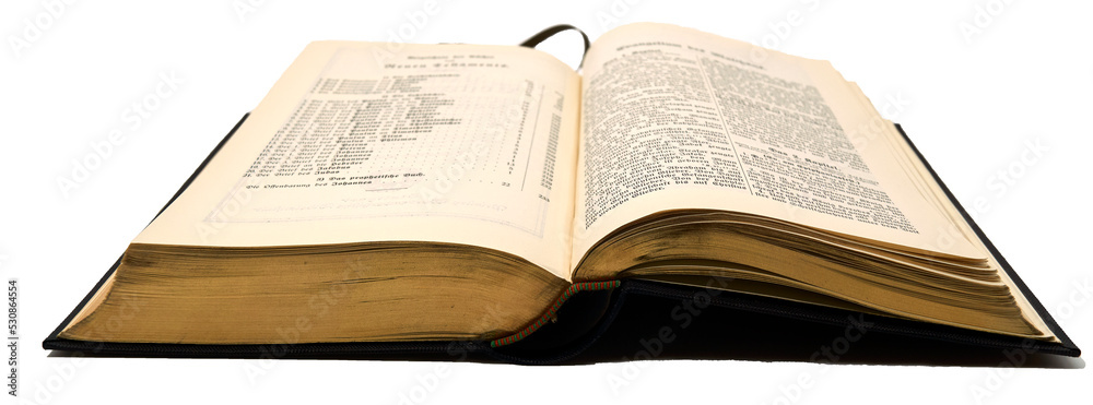 An old book with gilded pages. It's an old German bible opened on the ...