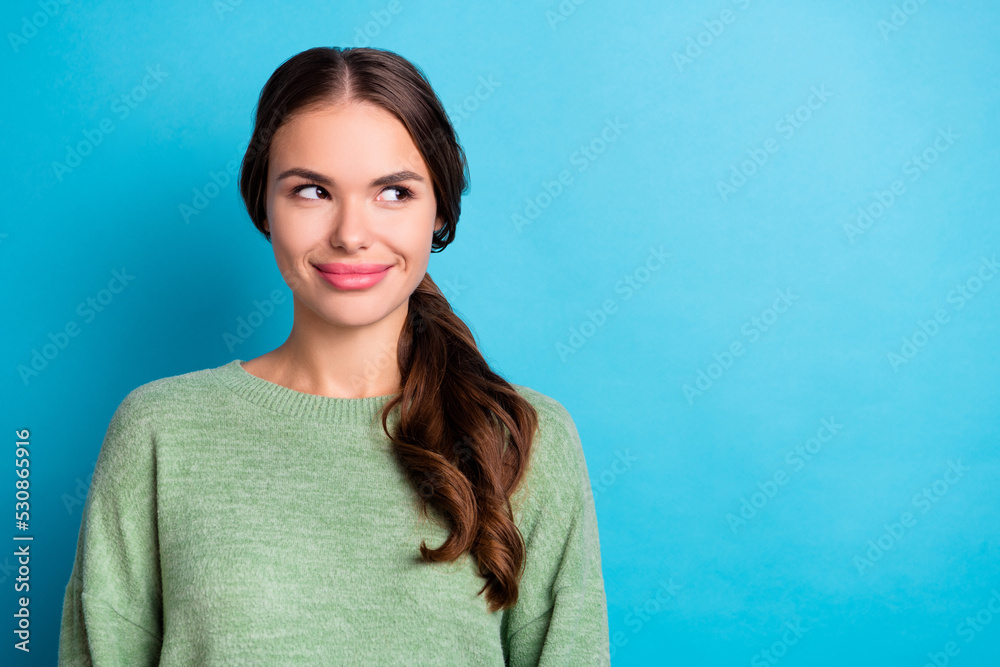 Portrait of adorable cute girl look interested empty space imagine brainstorm isolated on blue color background Portrait of adorable cute girl look interested empty space imagine brainstorm isolated on blue color background
