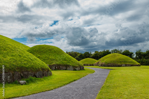 The megalithic tombs of Newgrange in Ireland photo