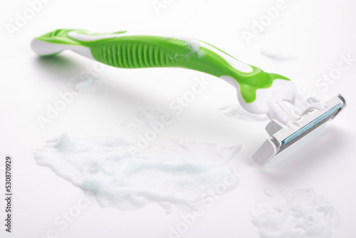 Shaving machine and foam on a white background.