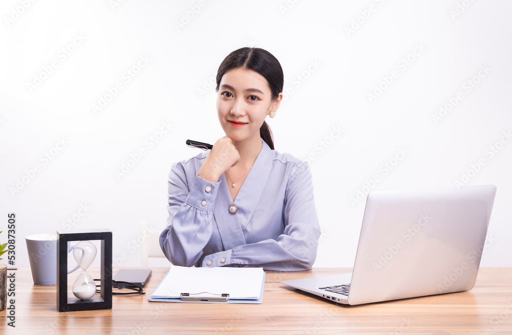 Business women who sit at their desks Business women who sit at their desks