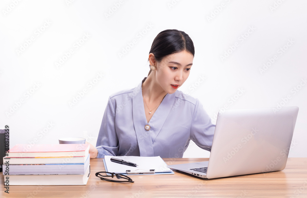 Business women who sit at their desks Business women who sit at their desks