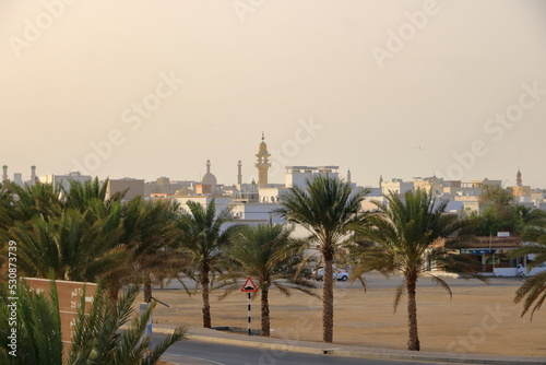 March 21 2022 - Sur, Oman: image of street life in Sur town with white houses in Southern Oman