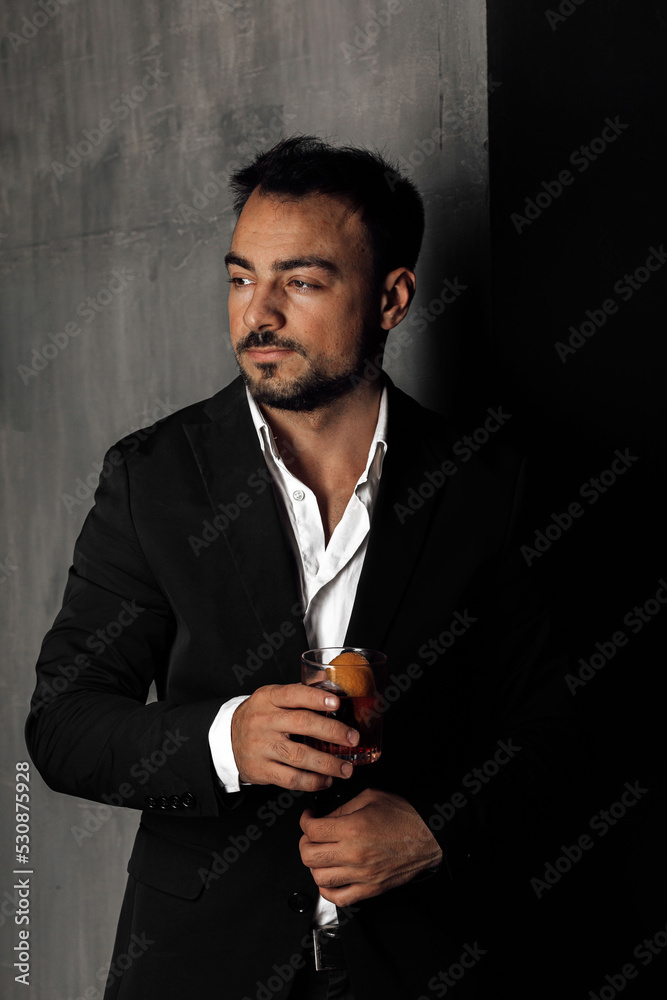man with a glass of negroni man with a glass of negroni