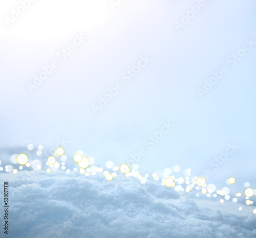 Fresh snow texture background in blue tone and sunlight.