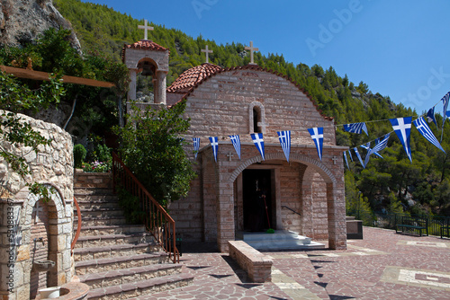 Τhe church of the Dormition of the Virgin ,in the monastery of Saint Patapios  in Loutraki,Corinthia, Peloponnese,  Greece. Sunny summer day with blue sky photo