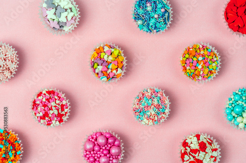 Patter from confectionery decor, the sweetest day. Abstract background. Bright background.