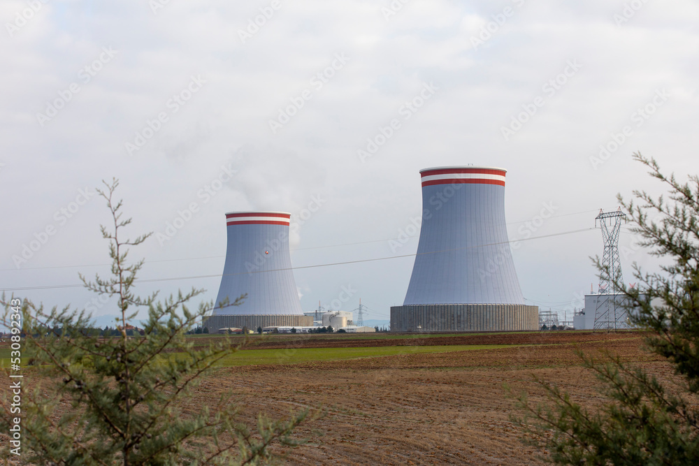 a nuclear power plant emitting smoke in air a nuclear power plant emitting smoke in air