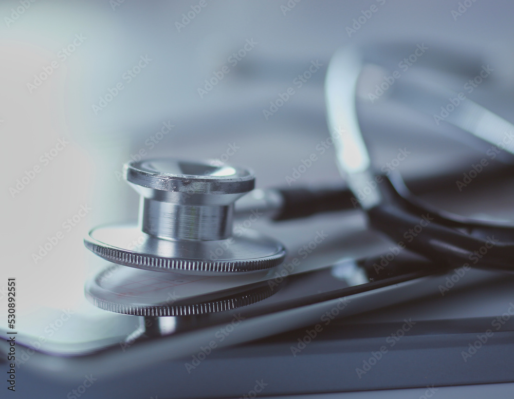 Medical equipment: blue stethoscope and tablet on white background. Medical equipment Medical equipment: blue stethoscope and tablet on white background. Medical equipment