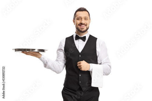 Waiter carrying a silver tray and smiling
