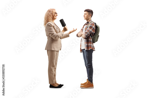 Female reporter interviewing a male student