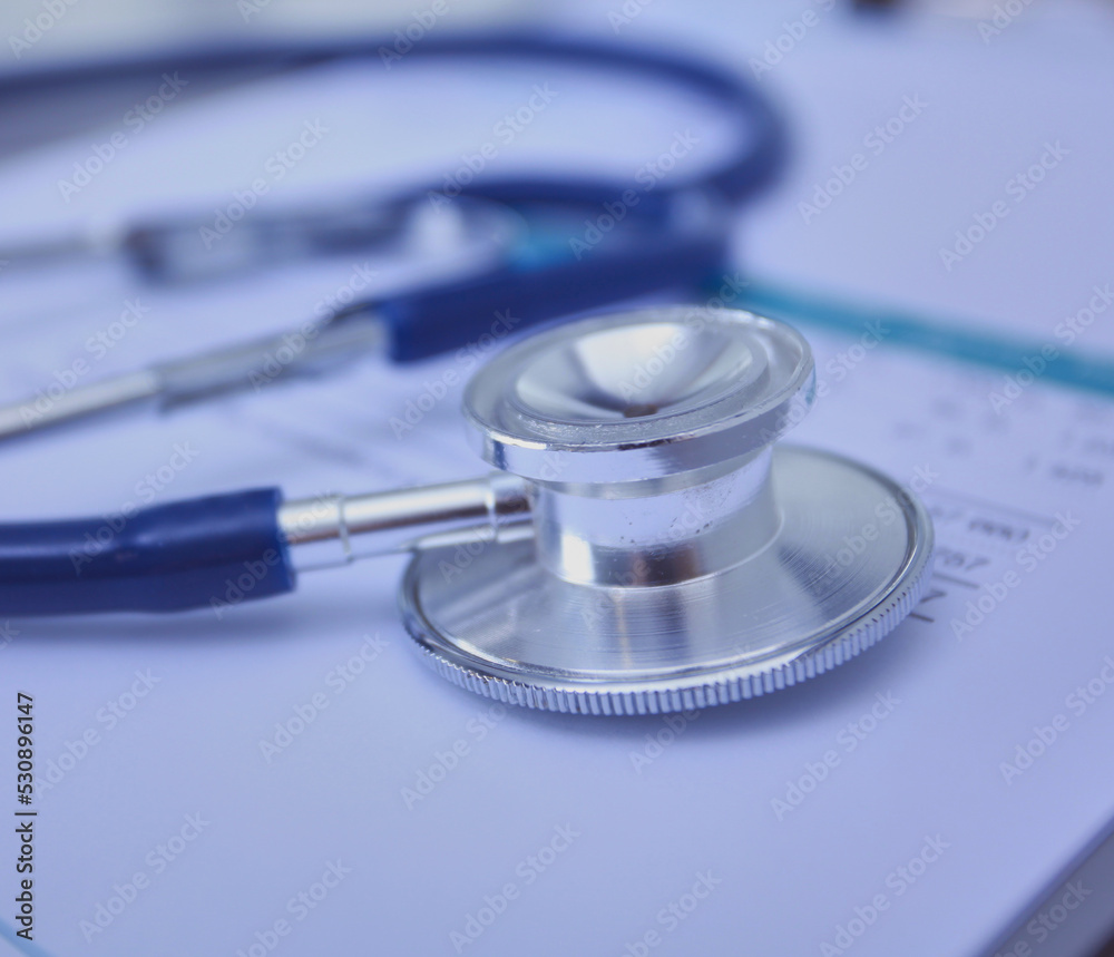 Medical equipment: blue stethoscope and tablet on white background. Medical equipment Medical equipment: blue stethoscope and tablet on white background. Medical equipment