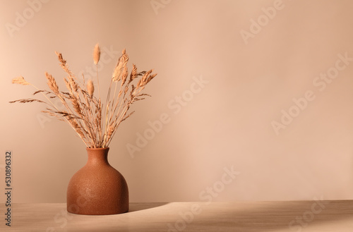 Vase with dried grass