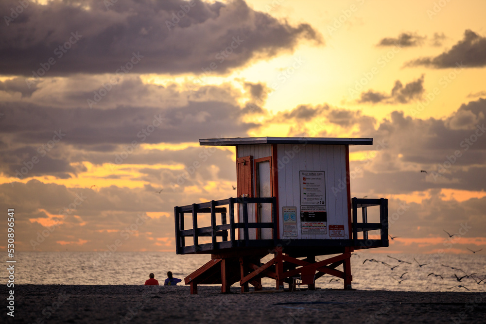 Lifeguard hut with cloudscape during sunrise at the beach Lifeguard hut with cloudscape during sunrise at the beach